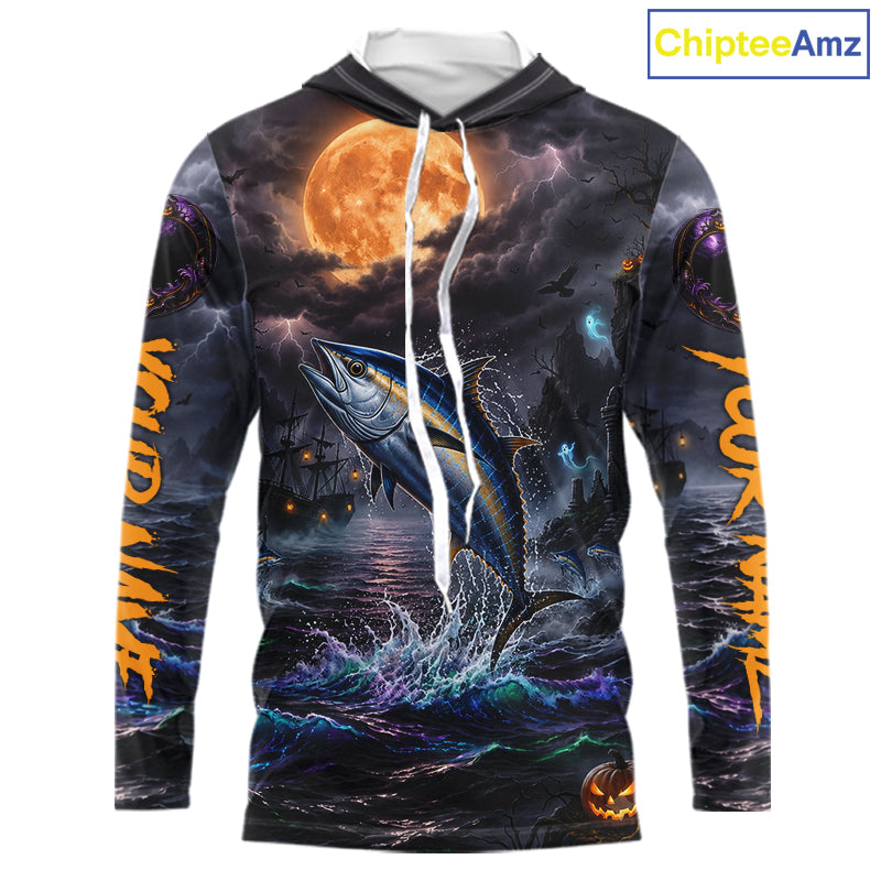 A long-sleeve hoodie with an all-over Halloween-themed graphic print featuring a jumping fish under a full moon, dark stormy sky, lightning, and orange text on the sleeves. The hoodie has a white drawstring and is shown on a plain white background with a ChipteeAmz logo in the top right corner.