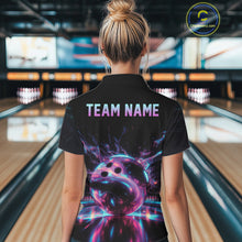 Load image into Gallery viewer, Person wearing a black bowling shirt with a colorful bowling ball design and 'TEAM NAME' text in a bowling alley.