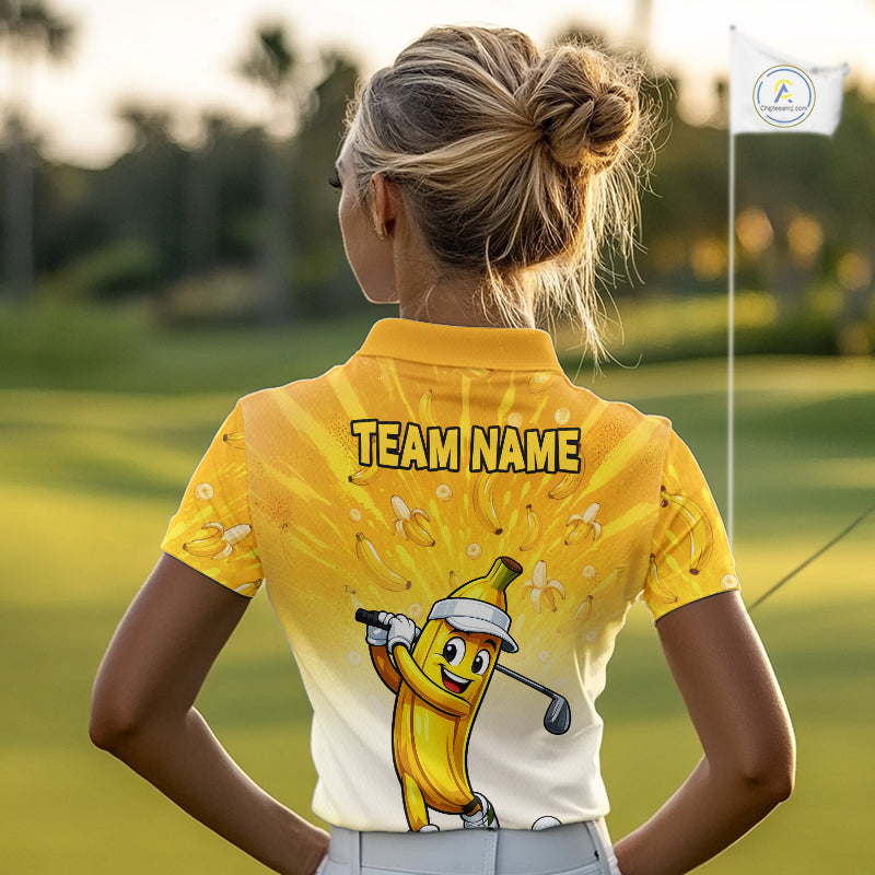 Person wearing a yellow and white golf shirt with a cartoon banana character on a golf course.
