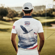 Load image into Gallery viewer, Man wearing a white polo shirt with an eagle design and 'America 250' text on a golf course.