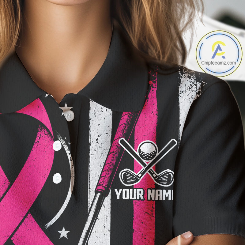 Close-up of a person wearing a black polo shirt with a pink and white striped golf-themed graphic print, featuring crossed golf clubs, a golf ball, stars, and placeholder text 'YOUR NAME'.