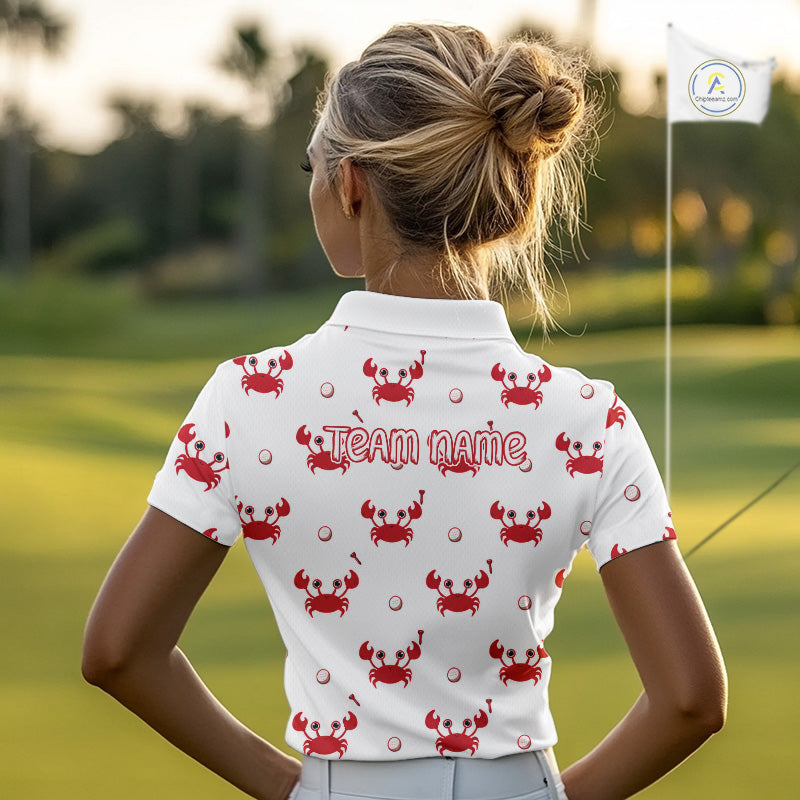 Person wearing a white polo shirt with red crab patterns and 'Team Name' text on a golf course.