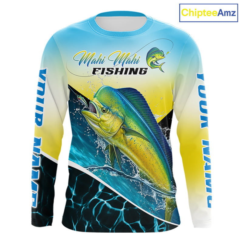 A long-sleeve crewneck fishing shirt with a vibrant Mahi Mahi fish graphic on the front, a blue-to-yellow gradient background, and 'Mahi Mahi FISHING' text across the chest. The sleeves feature 'YOUR  NAME' branding.