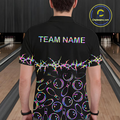A man viewed from behind wearing a black bowling-themed short-sleeve polo shirt with 'TEAM NAME' printed on the back, a colorful neon thorn pattern across the middle, and bowling pins and balls printed below. The background shows bowling lanes.