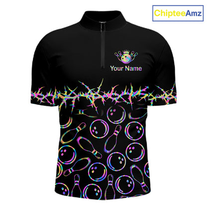 A black short-sleeve quarter-zip athletic shirt with bowling-themed graphics, including bowling pins, bowling balls, and a rainbow-colored foil burst across the chest and sleeves. The shirt features a mock collar and a zipper, with 'Your Name' and a crown graphic on the left chest.