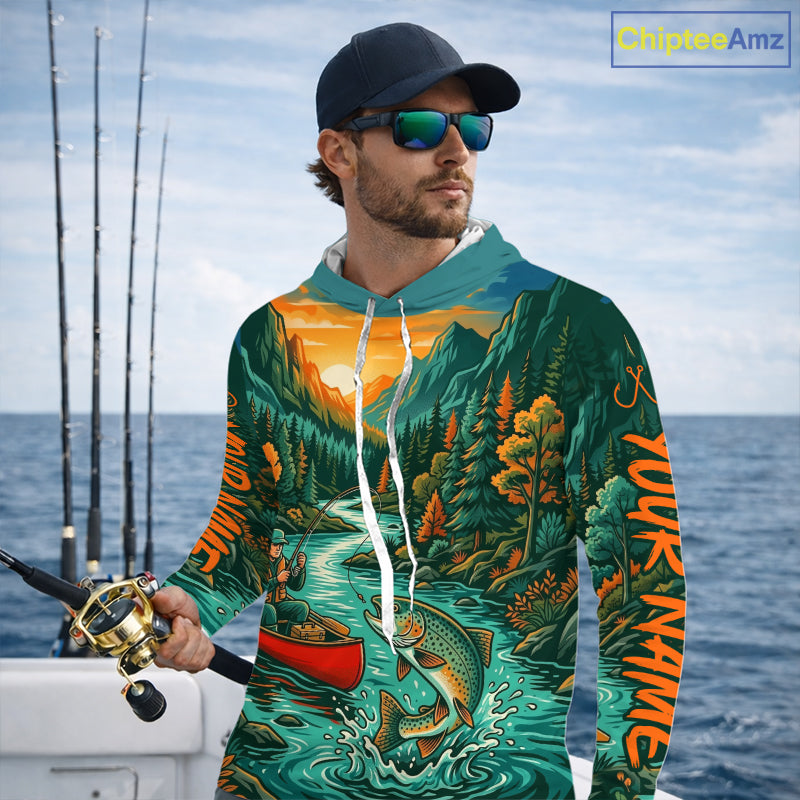 Man wearing a colorful hoodie with nature design by the sea