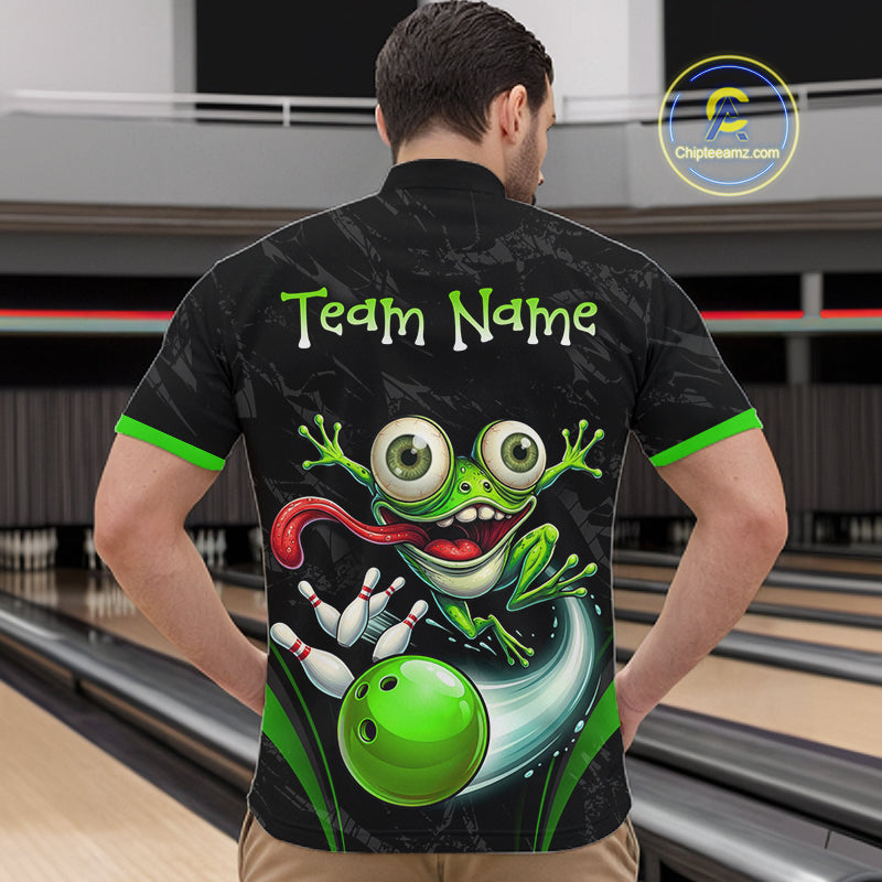 A man viewed from behind wearing a black bowling-themed short-sleeve button-up shirt with a large green cartoon frog graphic and the text 'Team Name' on the back. Bowling lanes are visible in the background, and a 'Chipteeamz.