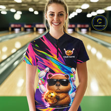 Load image into Gallery viewer, erson wearing a colorful bowling shirt with a bear design in a bowling alley.