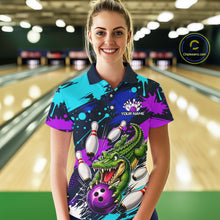 Load image into Gallery viewer, Woman wearing a colorful bowling shirt with a dragon design in a bowling alley.