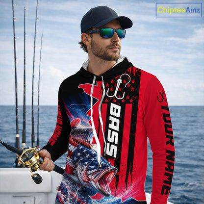 Angler wearing custom American flag bass patriotic red camo long sleeve hooded fishing shirt on the water