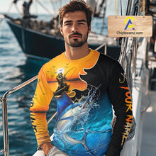 Load image into Gallery viewer, Man wearing a colorful fishing shirt on a boat with water and sky in the background with custom name on the sleeves