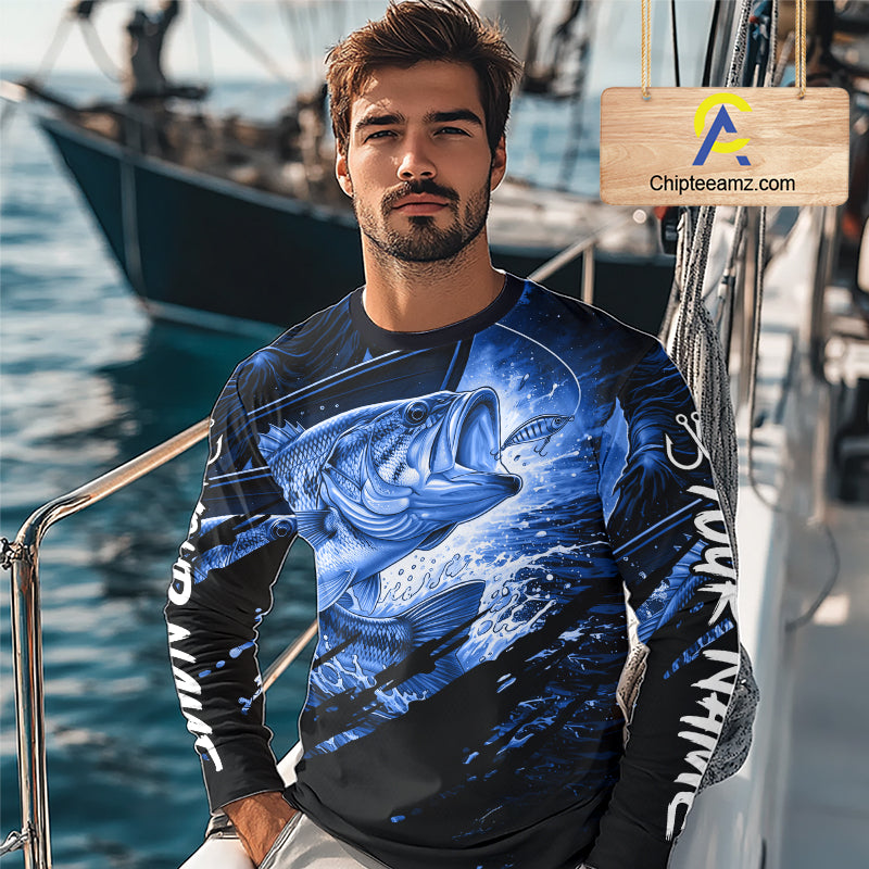Man wearing a long sleeve fishing shirt with a bass fish design on a boat