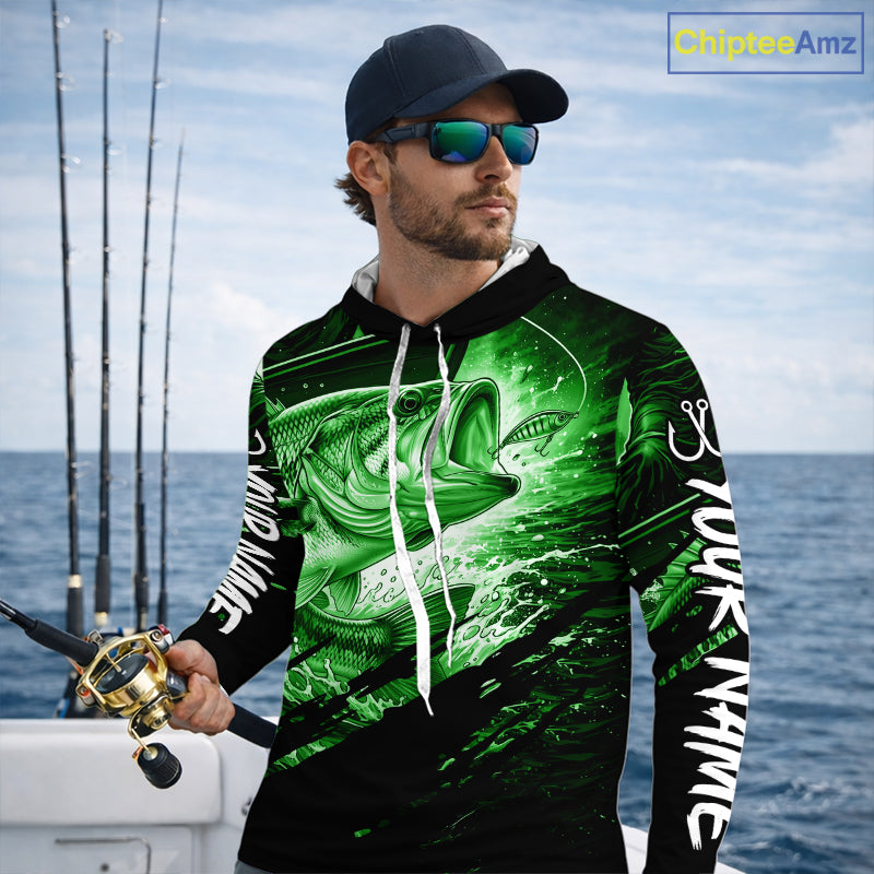 Man wearing a long sleeve hooded fishing shirt with a green bass fish design on a boat