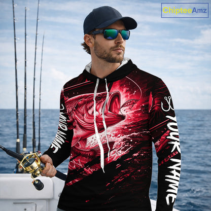Man wearing a long sleeve hooded fishing shirt with a red bass fish design on a boat