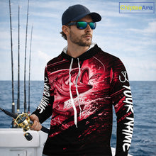Load image into Gallery viewer, Man wearing a long sleeve hooded fishing shirt with a red bass fish design on a boat