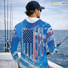 Load image into Gallery viewer, Man on a boat wearing a blue American flag long sleeve hooded fishing shirt 