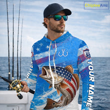 Load image into Gallery viewer, Man wearing a blue patriotic bass fishing shirt with custom name, standing on a boat