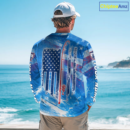 Man on a boat wearing a blue American flag redfish fishing shirt long sleeve with custom name on the sleeves