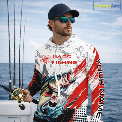 Man wearing a Bass long sleeve hooded fishing shirt on a boat with fishing rods