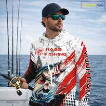 Load image into Gallery viewer, Man wearing a Bass long sleeve hooded fishing shirt on a boat with fishing rods