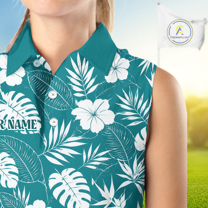 Person wearing a teal shirt with white floral and leaf pattern, blurred background