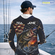 Load image into Gallery viewer, Man on a boat wearing a long sleeve hooded fishing shirt American flag and sunset design.