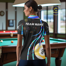 Load image into Gallery viewer, Back view of woman wearing a holographic 8 ball and 9 ball pool shirt in a billiards hall.