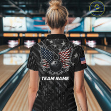 Load image into Gallery viewer, Back view of woman wearing a black American flag wings bowling polo shirt inside a bowling alley.