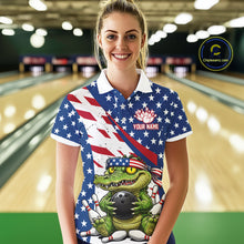 Load image into Gallery viewer, Women wearing a patriotic polo shirt with an alligator  graphic in a bowling alley.