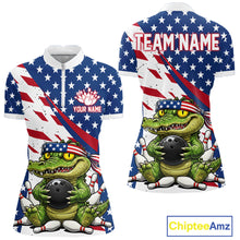 Load image into Gallery viewer, A quarter zip shirts with an alligator holding a bowling ball design, one with an American flag pattern and customized name text