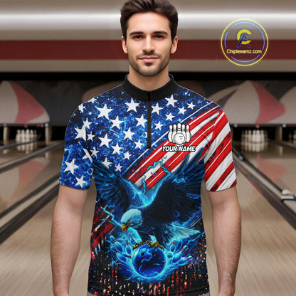 Man wearing an American flag quarter - zip shirt with an eagle design in a bowling alley, holding a bowling ball.