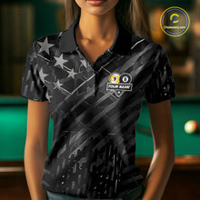 Load image into Gallery viewer, Woman wearing a black polo shirt with pool ball design and text, holding a pool cue in a billiards setting.