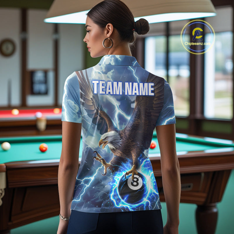 Back view of woman wearing a blue thunder eagle pool team shirt in a billiards hall.