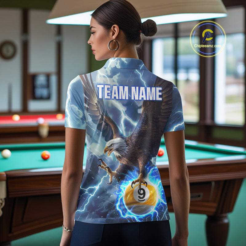 Back view of woman wearing a blue lightning eagle pool team shirt in a billiards hall.