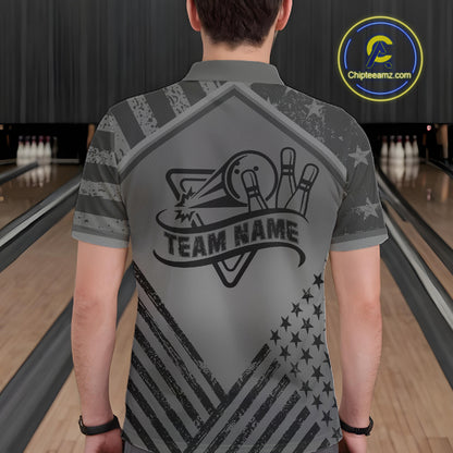 Back view of man wearing a grey American flag bowling polo shirt inside a bowling alley.