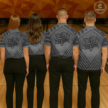Load image into Gallery viewer, Back view of bowling team wearing matching grey American flag bowling jerseys in a bowling alley.