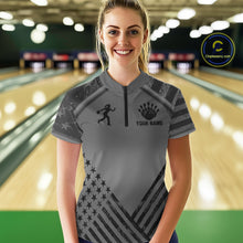 Load image into Gallery viewer, Front view of woman wearing a grey American flag bowling quarter zip shirt inside a bowling alley.