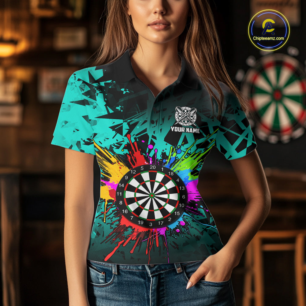 Woman wearing a turquoise dartboard darts shirt during league match front view.