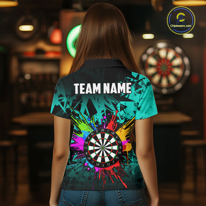 Back view of woman wearing a turquoise colorful darts jersey inside a darts hall.