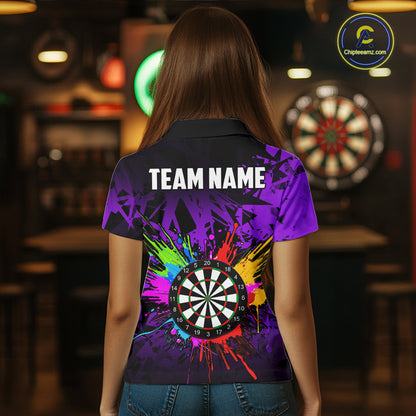 Back view of woman wearing a colorful purple darts jersey inside a darts hall.