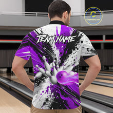Load image into Gallery viewer, Back view of man wearing a purple splatter bowling quarter zip shirt in a bowling alley.