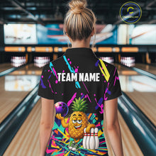 Load image into Gallery viewer, Back view of woman wearing a colorful pineapple bowling polo shirt inside a bowling alley.