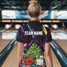 Load image into Gallery viewer, Back view of woman wearing a colorful sunflower bowling polo shirt inside a bowling alley.