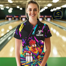 Load image into Gallery viewer, Woman wearing a colorful bowling-themed shirt with a chicken graphic in a bowling alley.