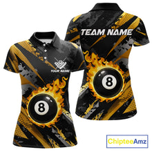 Load image into Gallery viewer, Black and gold billiard polo shirt for women with flaming 8-ball design and customizable team name and player name details.
