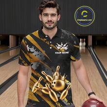 Load image into Gallery viewer, Man wearing a black and gold bowling shirt with a crown design on a bowling alley.