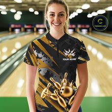 Load image into Gallery viewer, Woman wearing a black and gold bowling shirt with a crown design in a bowling alley.