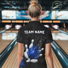 Load image into Gallery viewer, Woman wearing black and blue grunge fire bowling polo shirt back view.