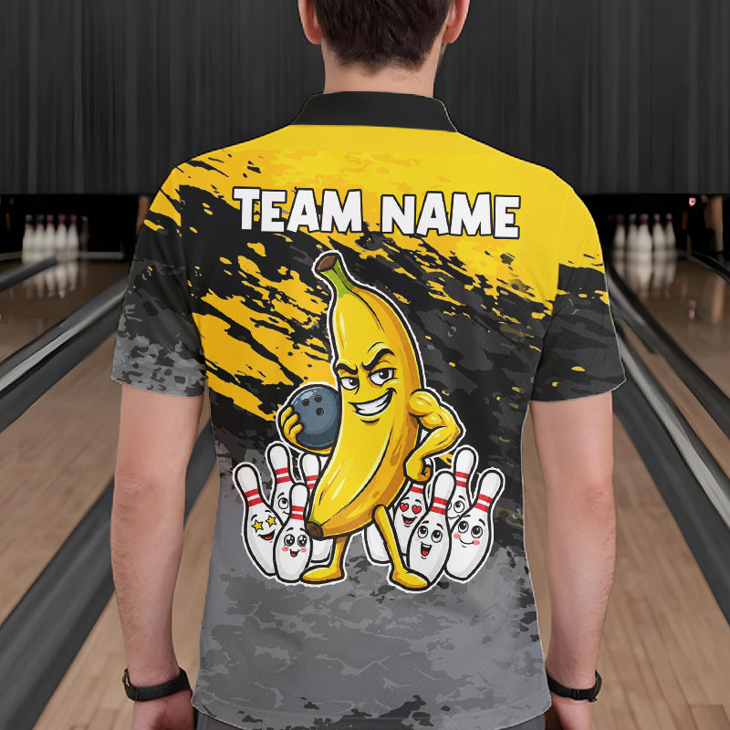 Back view of man wearing a yellow funny banana bowling polo shirt inside a bowling alley.