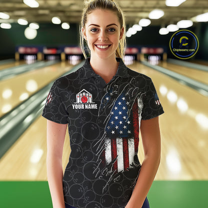 Woman wearing a vintage American flag black bowling polo shirt at a bowling alley front view.